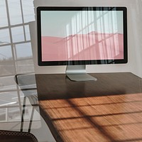 Computer screen mockup, wooden table psd