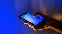 Woman using a blue screen phone