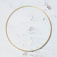 Round gold frame on weathered white paint textured background vector
