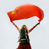 Woman holding the Chinese flag