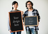 Asian couple is holding blackboard mockups
