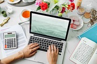 Woman using laptop, work from home photo