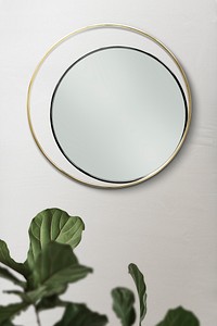 Double mirror on a beige wall with fiddle-leaf fig leaves mockup 