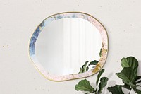 Marble framed mirror on a beige wall