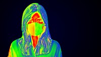 Woman wearing a face mask during coronavirus pandemic thermal image