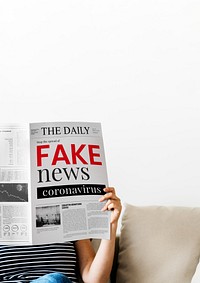 Woman reading fake coronavirus news from a newspaper during coronavirus quarantine