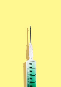 Syringe with a green solution on a yellow background