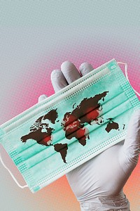 Hand wearing glove holding contaminated world map on surgical mask