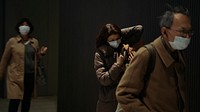 Commuters wearing disposable masks hoping to prevent the spread of corona virus (COVID-19). FEBRUARY 27, 2020 -  YOKOHAMA, JAPAN