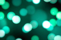 Turquoise green bokeh patterned background
