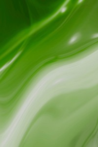 White and green swirl patterned background