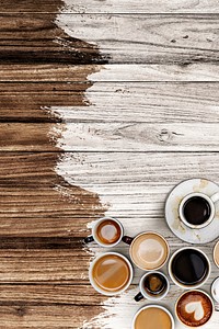 Coffee mugs on a pale white and brown wooden textured background