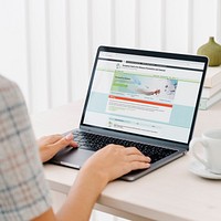 Woman reading coronavirus information from a laptop mockup with editorial graphic from <a href="https://www.ecdc.europa.eu/en">https://www.ecdc.europa.eu/en</a> accessed on April 8th 2020. BANGKOK, THAILAND - JANUARY 19, 2018
