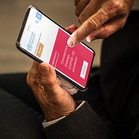 Woman reading coronavirus information from a phone mockup with editorial graphic from <a href="https://www.who.int/">https://www.who.int/</a> accessed on April 6th 2020. BANGKOK, THAILAND - MARCH 28, 2018