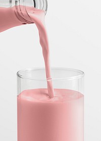 Strawberry milk poured into a glass 