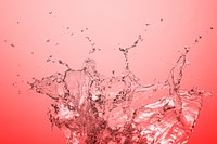 Water splashing on a red background design resource