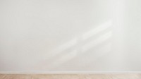 White blank concrete wall with a wooden floor