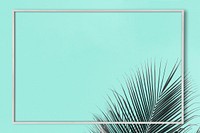 Palm leaf frame on a turquoise background 