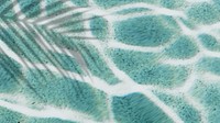 Palm leaf shadow on a turquoise terrazzo pool background