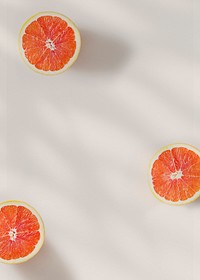 Cut natural grapefruits on beige background