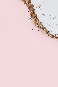 Gold glitter on simple pink background