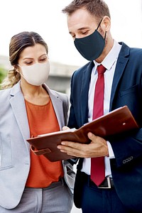 Business people in face mask working in new normal