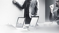 Young businessman presenting marketing plan in office black and white