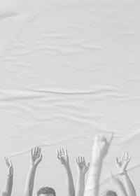 White arms raising on paper textured background