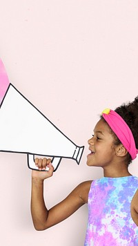 African kid holding paper megaphone on pink background