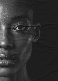 Artsy portrait closeup of African woman demonstration on paper texture background