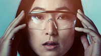 Woman touching AR smart glasses futuristic technology