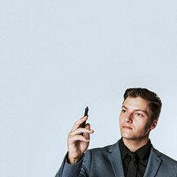 Young businessman holding smart pen