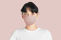 Woman wearing mask face closeup Covid-19 photoshoot on pink background