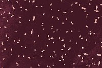 Pink confetti on a maroon marble textured background vector