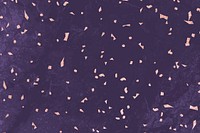 Pink confetti on a purple marble textured background vector