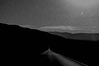 Creative background of mountain range with sky full of stars and crescent moon in black and white