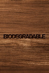 Biodegradable engraved wood typography on wooden background