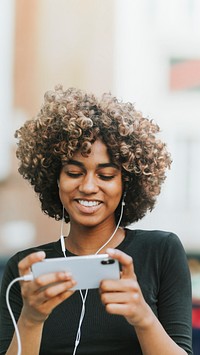 Beautiful woman using smartphone in the city remixed media