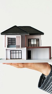 Hand presenting model house for home loan campaign