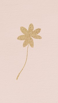 Golden shimmering leaf on a pink background