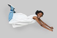Cheerful black woman in a tunic dress flying 