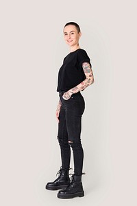 Tattooed woman in black t-shirt and jeans 