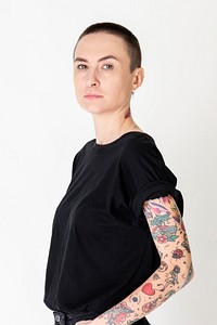 Skinhead model with tattoos in black T shirt