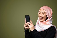 Portraits of a Muslim woman using a mobile phone