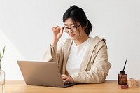 Studious Asian woman using a laptop 