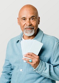 Retired man showing banknotes mockup