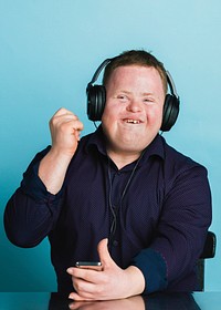 Cool young man with Down Syndrome listening to a sport podcast