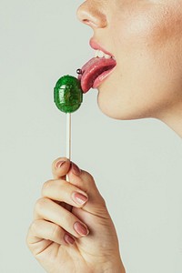 Beautiful woman enjoying a lollipop