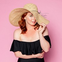 Woman wearing a straw hat on her summer vacation 