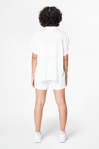 Women&rsquo;s white blouse and shorts street fashion rear view
